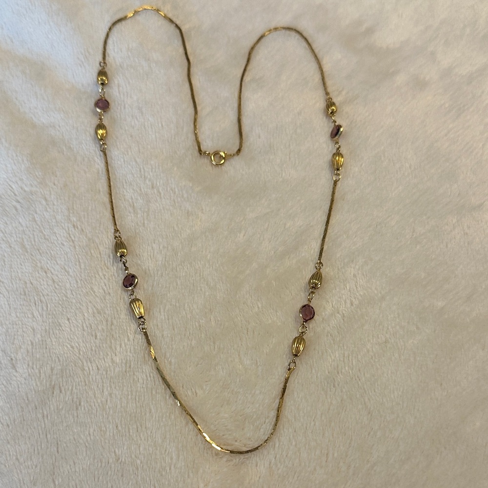 Elegant Gold tone, and amethyst glass stone Necklace. Made in Korea.